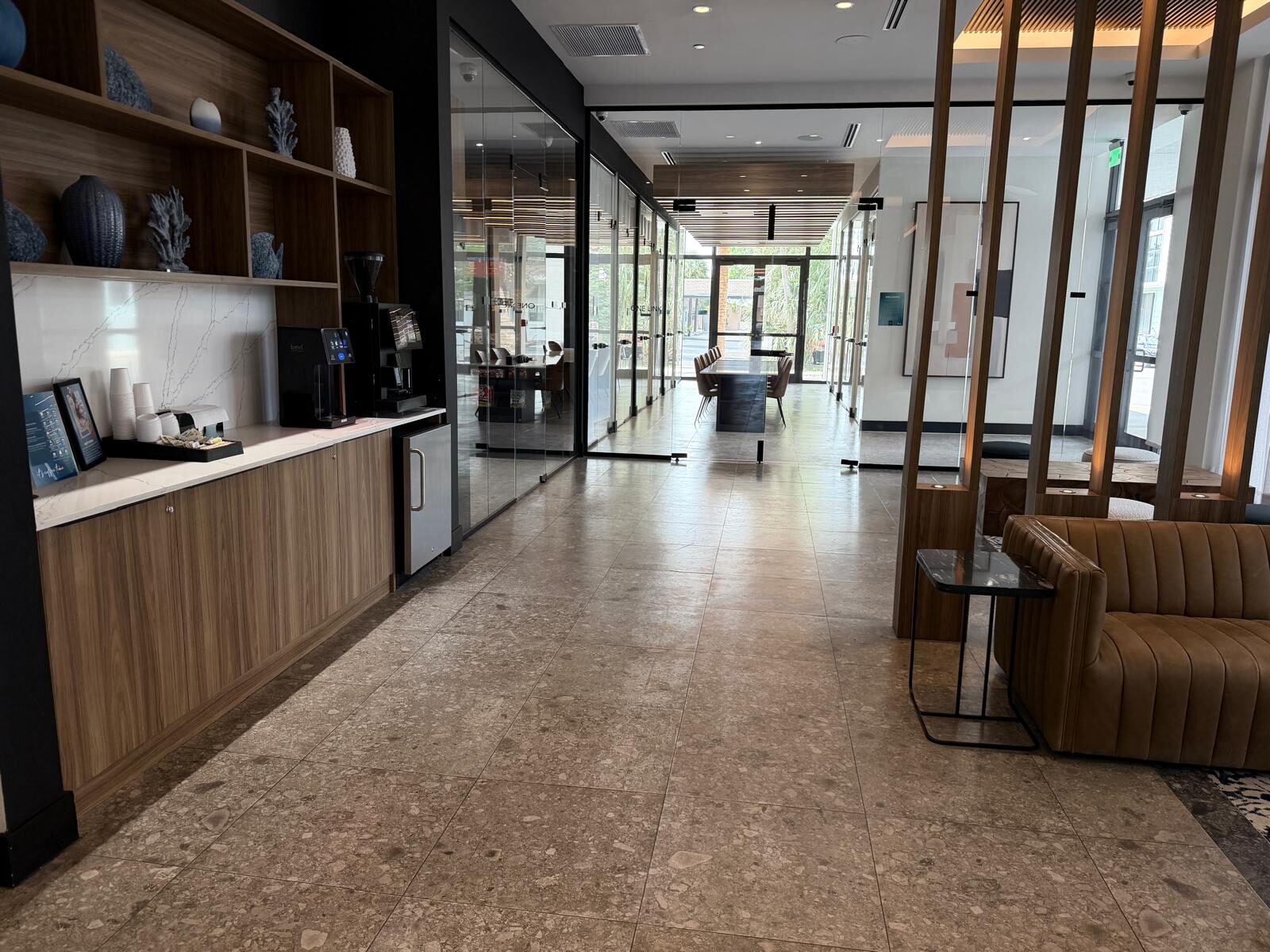 Lobby with a coffee bar and seating in the 101 Dania Beach building that houses the Behavior Specialists office
